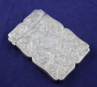 An early Victorian silver card case by Nathaniel Mills, of shaped rectangular form, engraved with