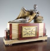 An Art Deco bronzed and silvered spelter and marble mantel clock, with rectangular dial signed