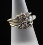 An 18ct gold and platinum graduated five stone diamond ring and two 18ct gold three stone diamond