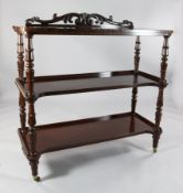 An early Victorian mahogany three tier buffet, with scroll carved back, 4ft H.4ft 2in.