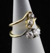 Two gold and two stone diamond cross-over rings, sizes K & L.