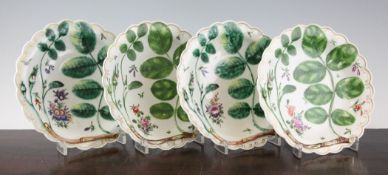 A set of four Worcester `Blind Earl` pattern plates, c.1770, each moulded and painted with rose buds