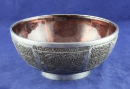 An early 20th century Chinese? pierced silver and ruby glass lined bowl, with fine foliate scroll