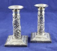 A pair of early 20th century Chinese silver dwarf candlesticks by Wang Hing, Hong Kong, with pierced