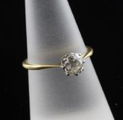 A 1920`s 18ct gold and platinum solitaire diamond ring, the old cut stone weighing approximately 0.