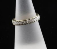 A gold and diamond full eternity ring, set with thirty stones, size L.