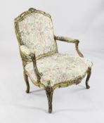 An 18th century French Louis XV carved giltwood fauteuil, with upholstered back, arms and seat, on