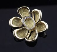 A 1960`s French 18ct gold and diamond set flowerhead brooch by Mauboussin, Paris, 1.75in, in