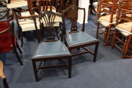 A set of eight Hepplewhite style mahogany dining chairs, two with arms, six singles, with ear of