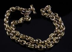 A three colour gold chain link necklace with cabochon ruby set T-bar, 17.5 in.