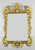 An 18th century carved giltwood wall mirror, with pierced acanthus and C scroll decoration and