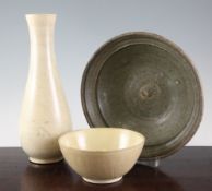 A Chinese Guan type pottery pear shaped vase, a celadon glazed bowl and a cream glazed pottery bowl,