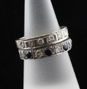 An 18ct white gold and diamond half eternity ring, with engraved shank and set with nine graduated