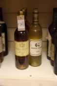Five bottles including three Chateau Suduiraut 1990, Sauternes, all into neck; one "Y" 1985,