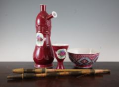 A Russian Gardner porcelain magenta-ground hookah, late 19th century, decorated with floral sprays