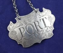 A George II silver "Port" wine label, of shaped cartouche form, with engraved fruiting vine
