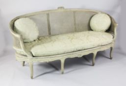 A French cream painted beech canapé, with floral crested top rail and cabriole legs, approx. 6ft