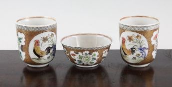 Two Chinese famille rose coffee cups and a teabowl, Yongzheng period, each painted with reserves