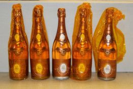 Five bottles of Louis Roederer Cristal Rose Champagne 1995; levels all 0.5cm or under, with German