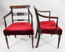 A pair of Regency mahogany elbow chairs, with satinwood banded crest rail, pierced tablet splat