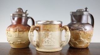 A `George and the Dragon` light salt glazed stoneware tyg, 19th century, a similar pewter lidded jug