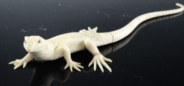 A Japanese sectional ivory figure of lizard, early 20th century, with two colour horn inset eyes,
