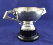 A George V silver two handled trophy cup, of plain circular form, with engraved armorial and angular