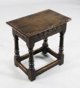 A James I oak joynt stool, with a fluted frieze, on turned supports, 1ft 6in.