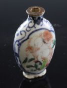 A Chinese enamelled porcelain snuff bottle, 19th century, of flattened ovoid form, painted to each