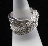 An 18ct white gold and diamond double band cross-over dress ring, set with graduated round and