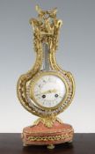 A 20th century French ormolu, paste and pink marble mantel clock, with floral pierced lyre shaped