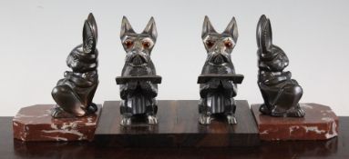 Two pairs of Art Deco bronzed spelter and marble bookends, modelled as seated rabbits by H.Moreau,