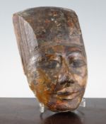 A carved wood mask (head of a sarcophagus) probably Thebes, retaining original painted pigments,