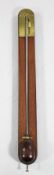 T. Blunt, London. A Regency mahogany stick barometer, with brass scale, exposed tube and domed