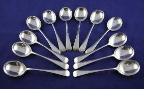 A matched set of twelve George V silver Old English pattern soup spoons, William Hutton & Sons
