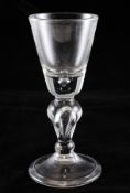 A large heavy baluster goblet, probably German c.1710, the funnel bowl with tear drop base above