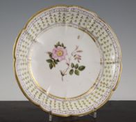 A Nantgarw porcelain dessert dish, c.1817, the centre painted with a titled flower specimen `Rosa