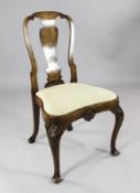 A George I style walnut dining chair, with vase shaped splat and drop in seat, on shell knees and