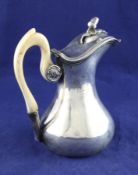 An early 19th century French 950 standard silver hot water jug, of baluster form, with engraved