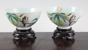 A pair of Chinese famille verte bowls, late 19th century, each painted with magpies on fruiting