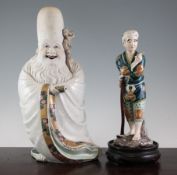 Two Japanese Kutani figures, Meiji period, the first of Fukurokuju in elaborate robes, holding a