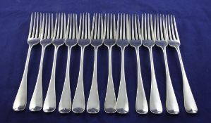 A set of twelve Victorian silver hanovarian pattern table forks by George Adams, London, 1841, 25