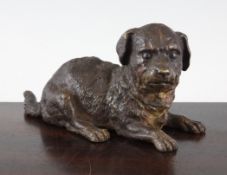 A Victorian continental cold painted bronze inkwell, modelled as a recumbent puppy, the base