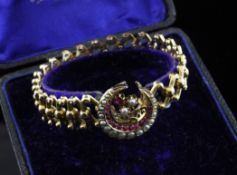 A Victorian 18ct gold expanding bracelet with centrepiece in the form of a ruby and split pearl