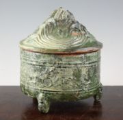 A Chinese green glazed pottery `hill` jar and cover, Han dynasty, the cylindrical body moulded in