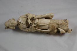 A large Japanese Tokyo School ivory figure of a bijin, Meiji period, wearing an elaborate brocade