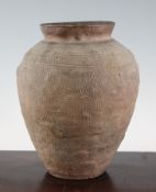 A Chinese pottery ovoid cloth textured jar, Waring States period, 9.5in. (24.3cm), repaired