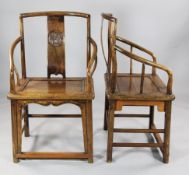 A pair of 19th century Chinese elm open arm chairs, with shaped splat back engraved with a dragon