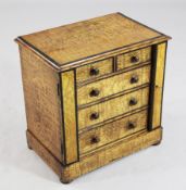 A late Victorian miniature ash and ebony banded chest, of two short and three long graduated