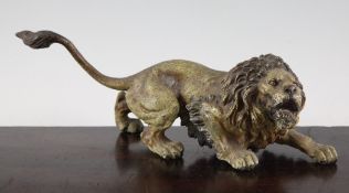 A 19th century Austrian cold painted bronze model of a crouching lion, 11in.